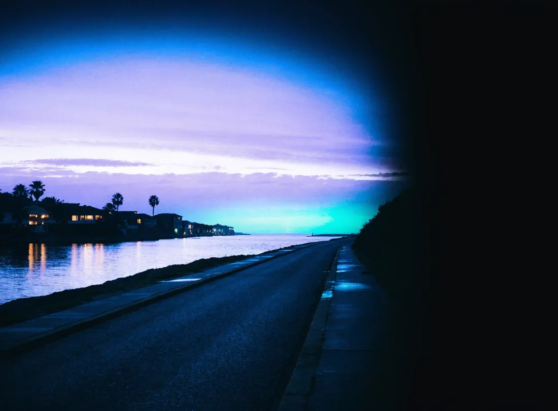 A coastal town at twilight where guests can explore local experiences